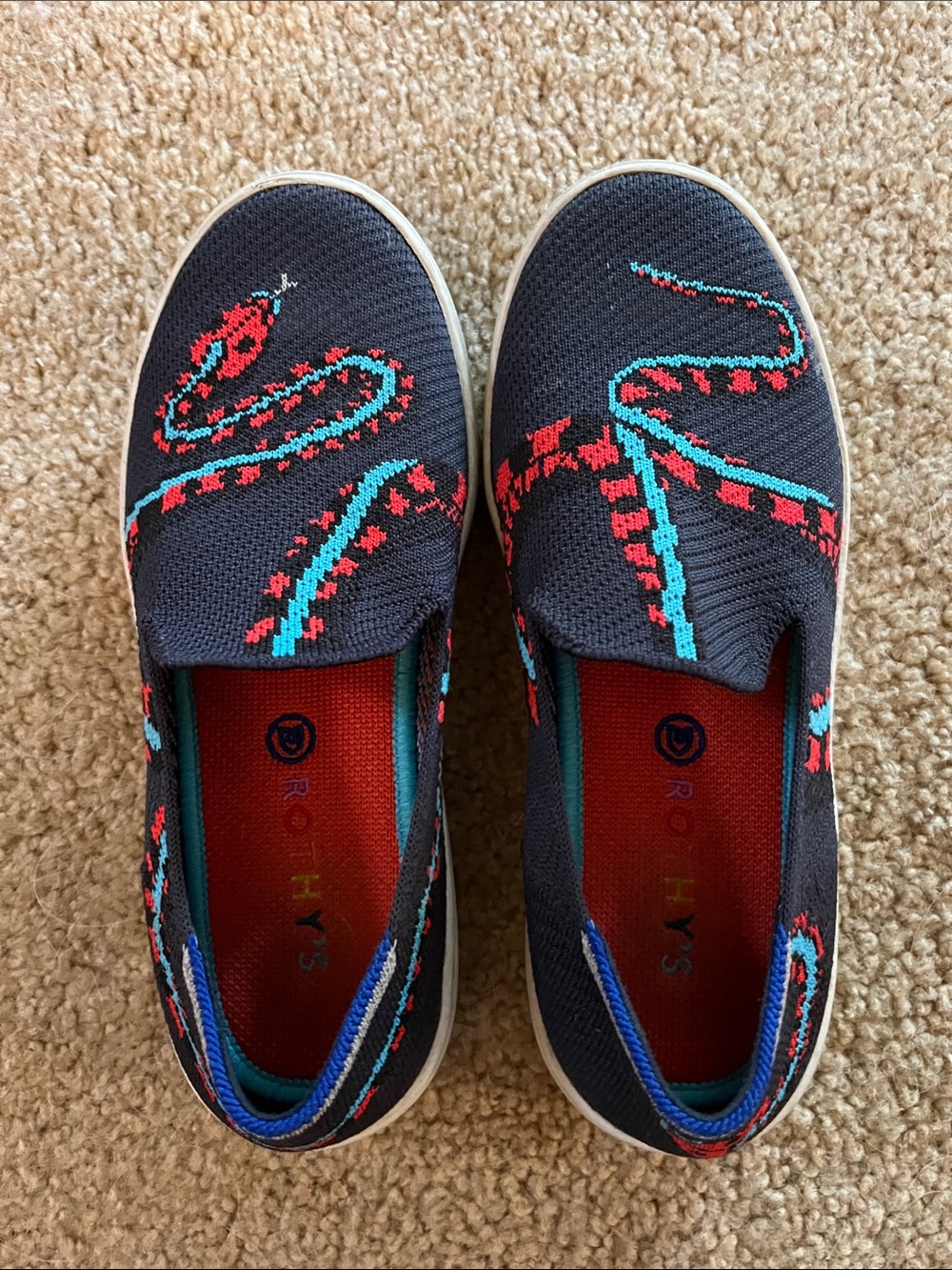 Rothy's Kids Slip-On Sneakers in navy, Red & Teal Snake Motif